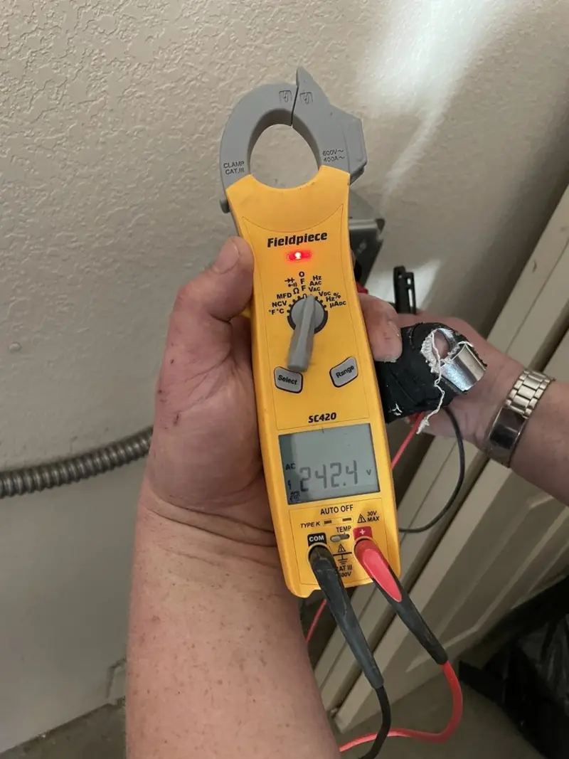Voltage testing with clamp meter during Ceiling Fan Installation in Conway